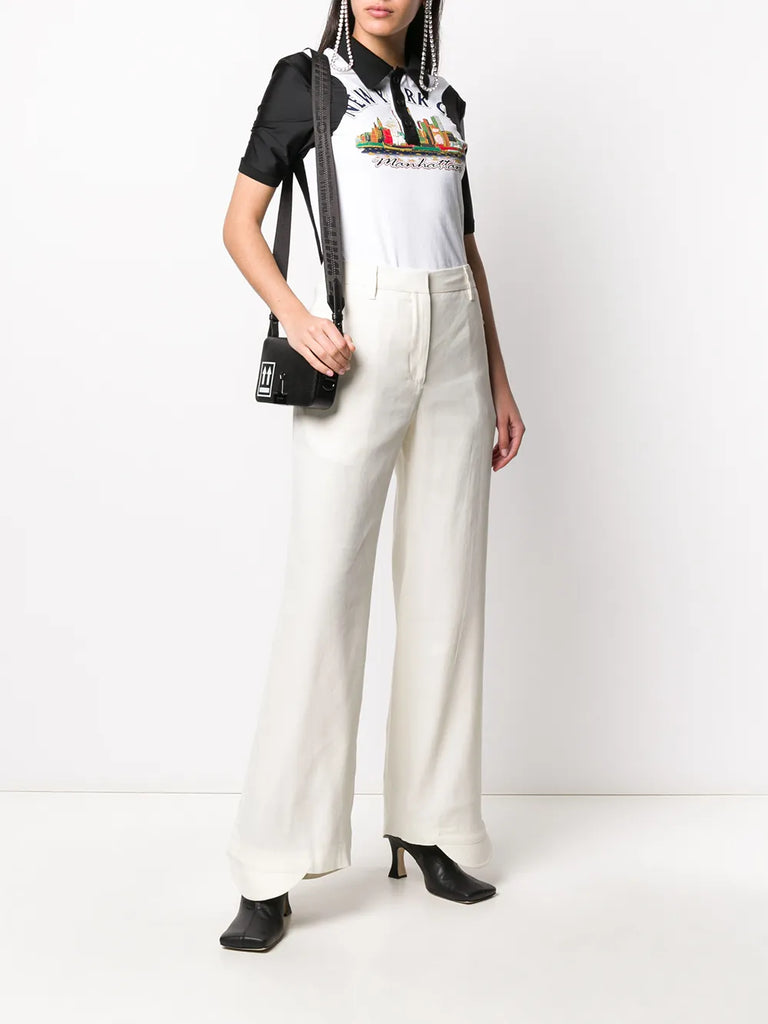 flared curved cuff trousers