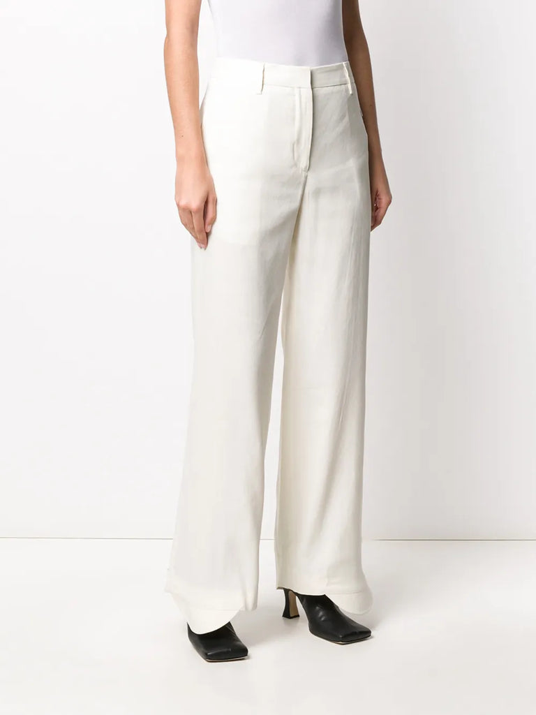 flared curved cuff trousers