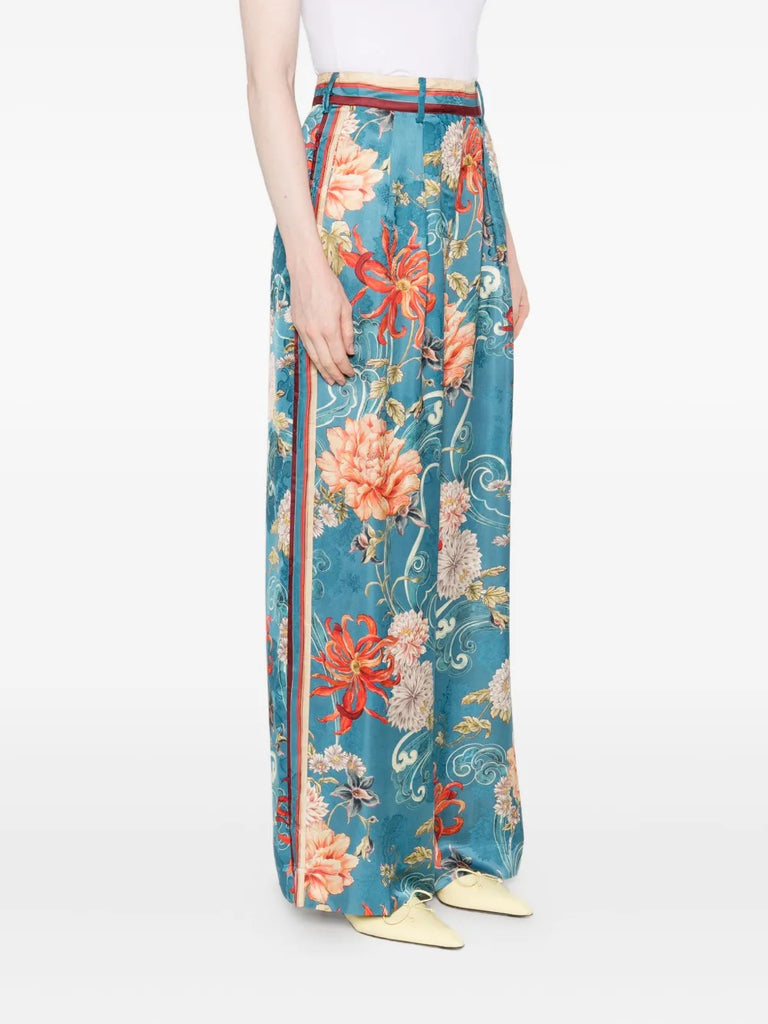 floral-print pleated trousers